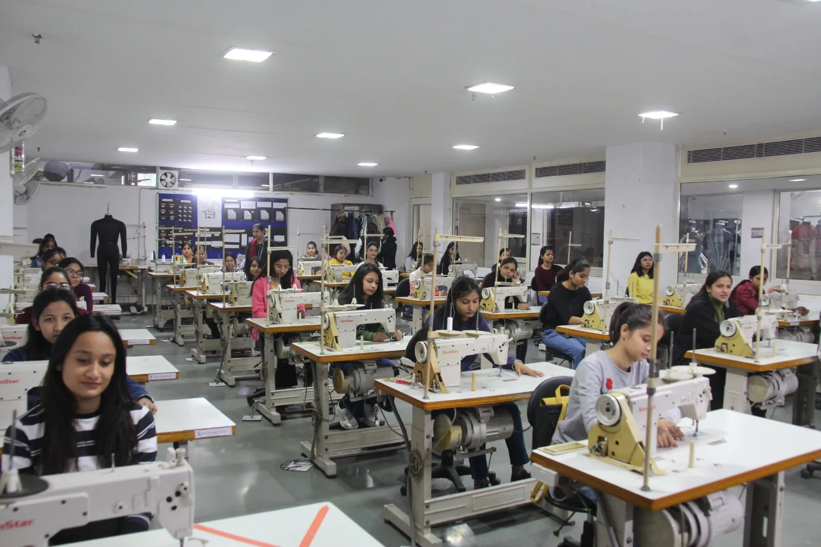 Fashion designer working with sewing machine