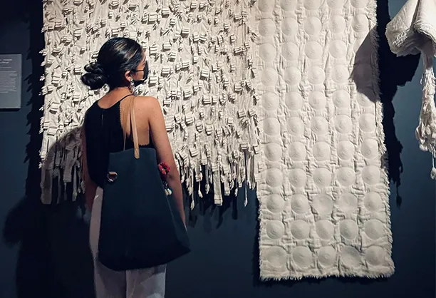  Admiring textile art installation