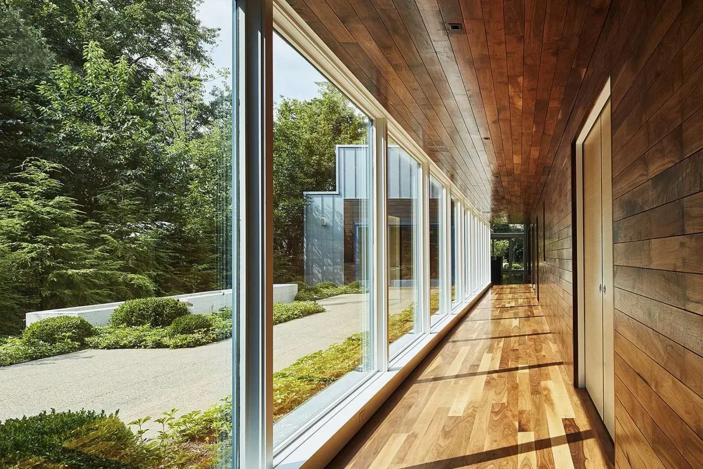  Hallway with large windows and sunlight