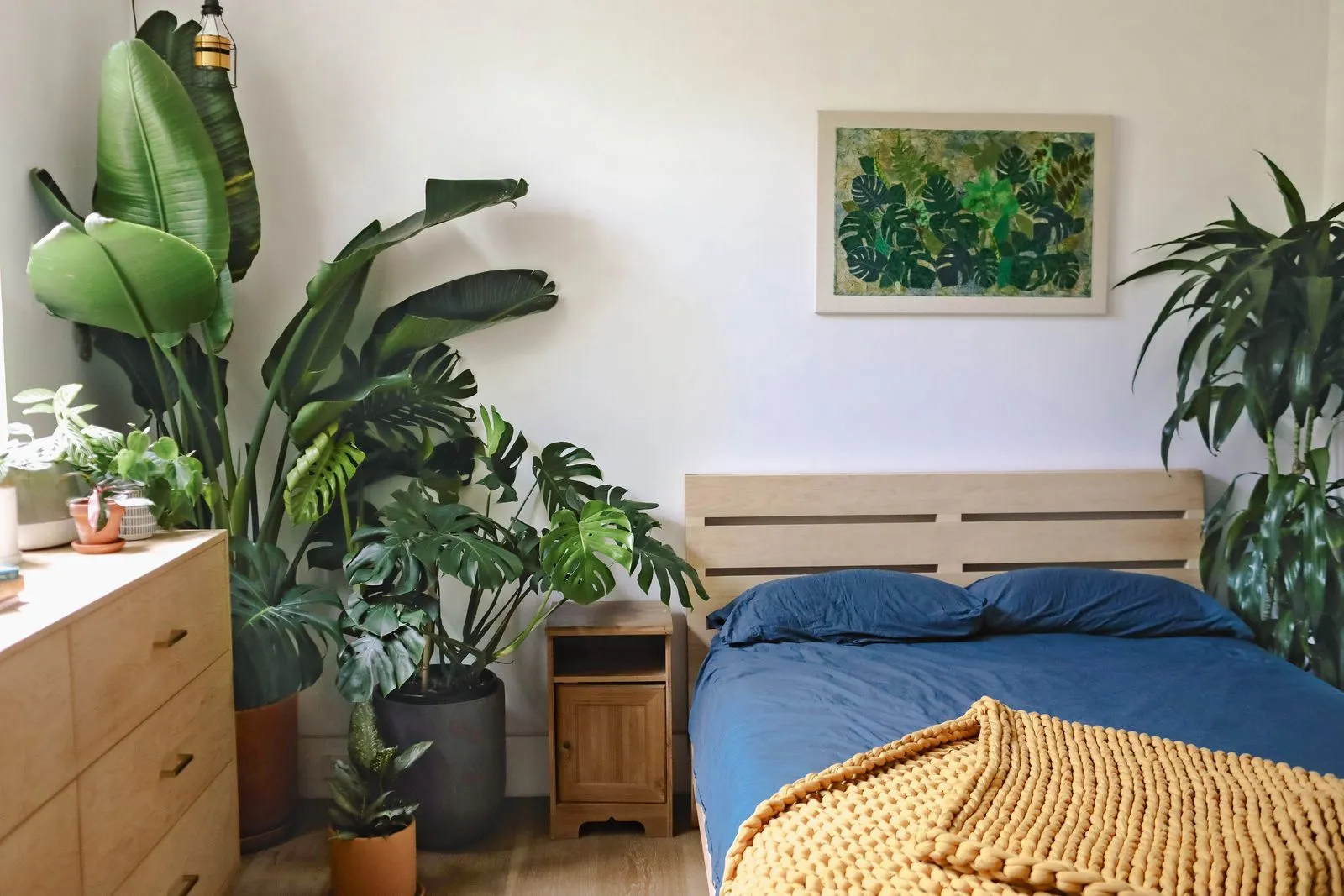 Bedroom with indoor plants and art